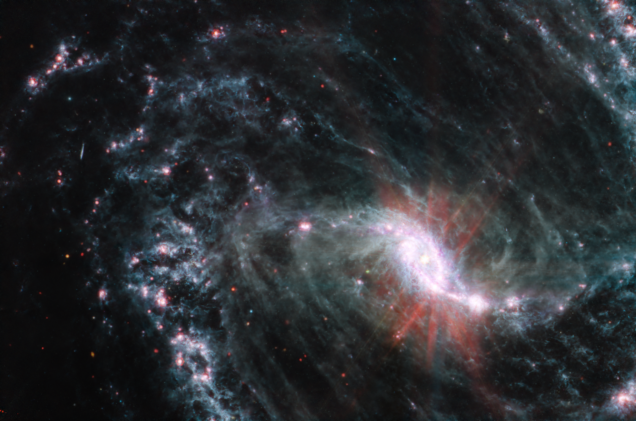 Stunning View of Barred Spiral Galaxy NGC 1365 Captured by Webb