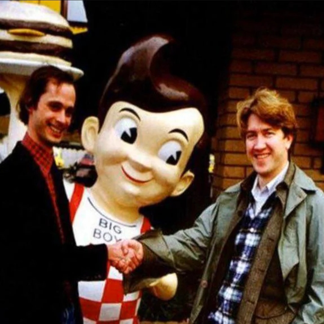 John Waters and David Lynch enjoying some Big Boy after the Eraserhead premiere.