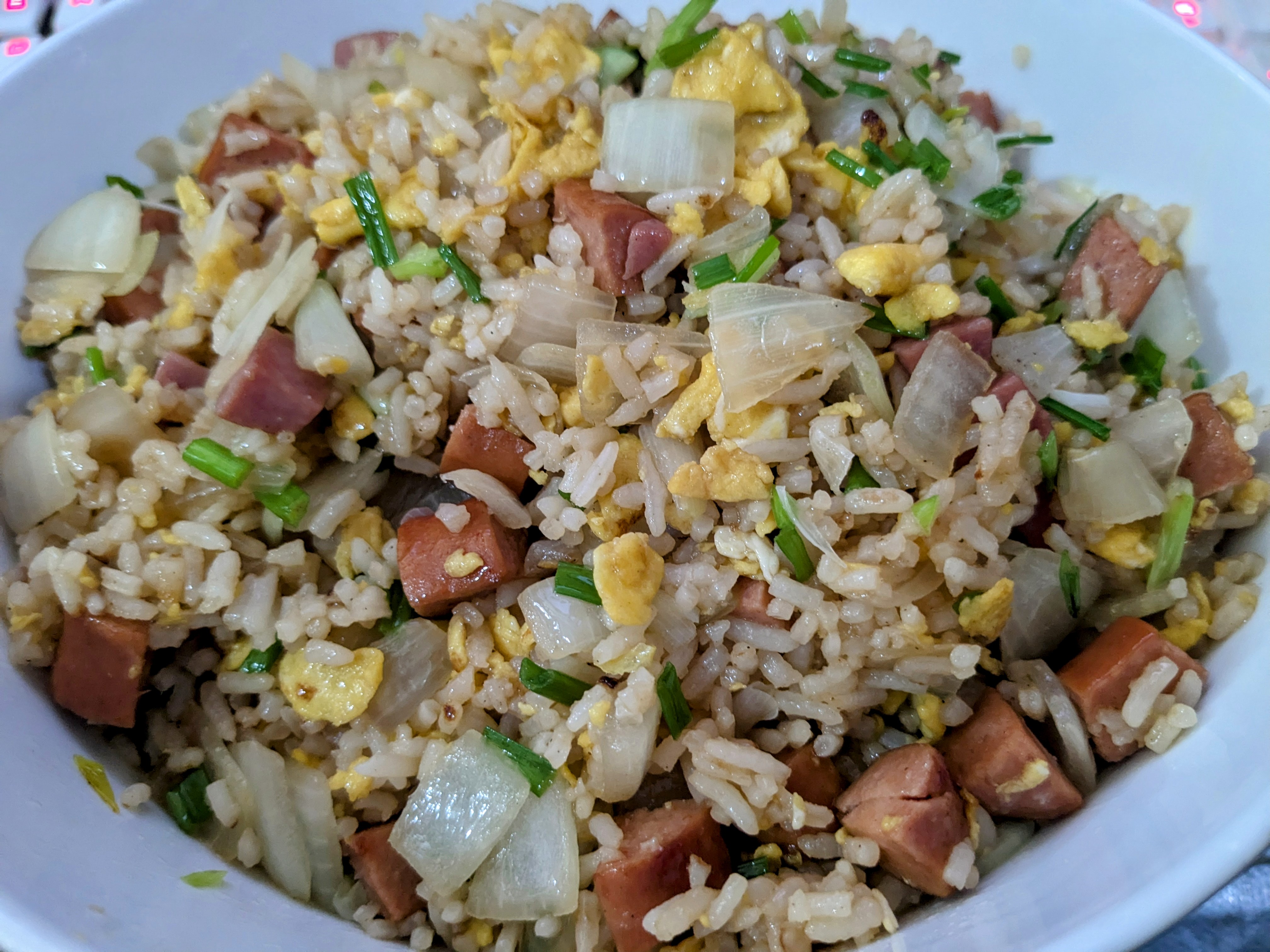 Delicious Beef Sausages Over Egg Fried Rice with Onions