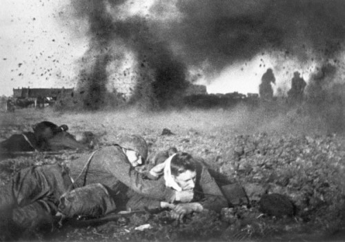 A poignant moment captured: A Soviet soldier cares for his injured comrade during the Battle of Moscow, September 1941. Photo by Anatoli Garanin.