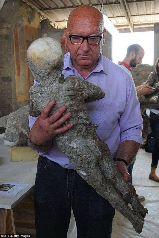 A Heartbreaking Moment: Stefano Vanacore with a Child Victim from Pompeii