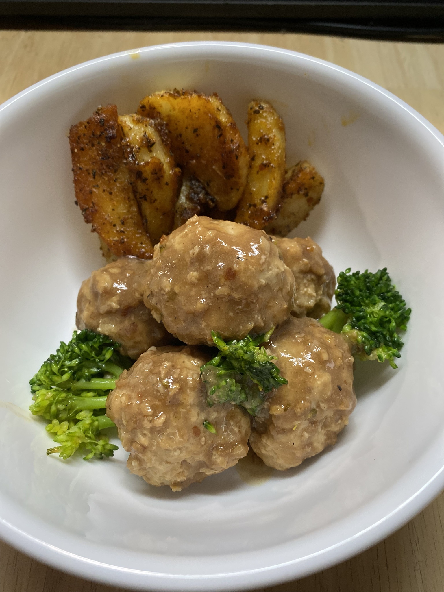 Delicious Chinese-Style Meatballs Paired with Crispy Potato Wedges