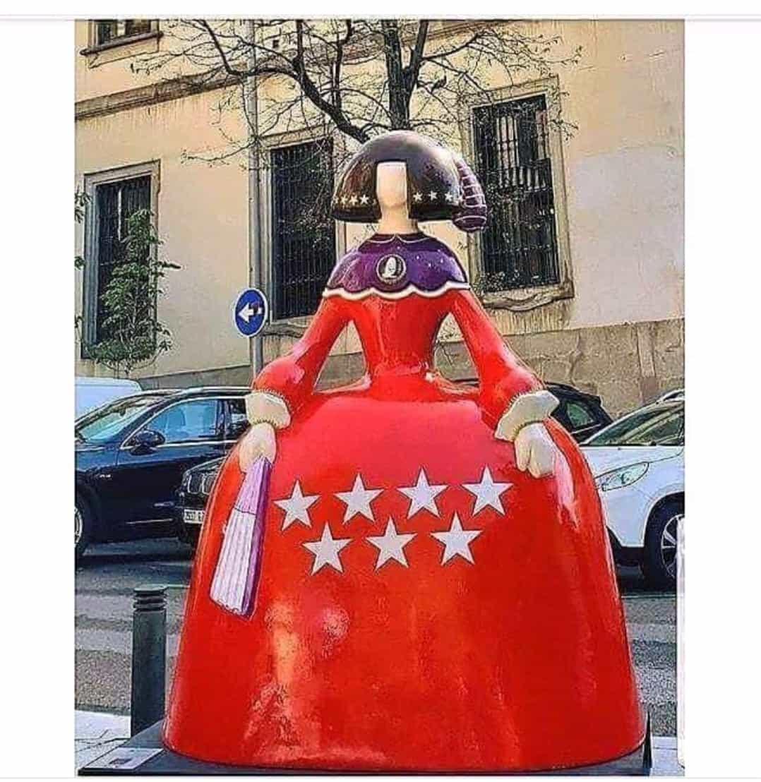 A Young Girl Dressed in the Colors of the Community of Madrid Flag